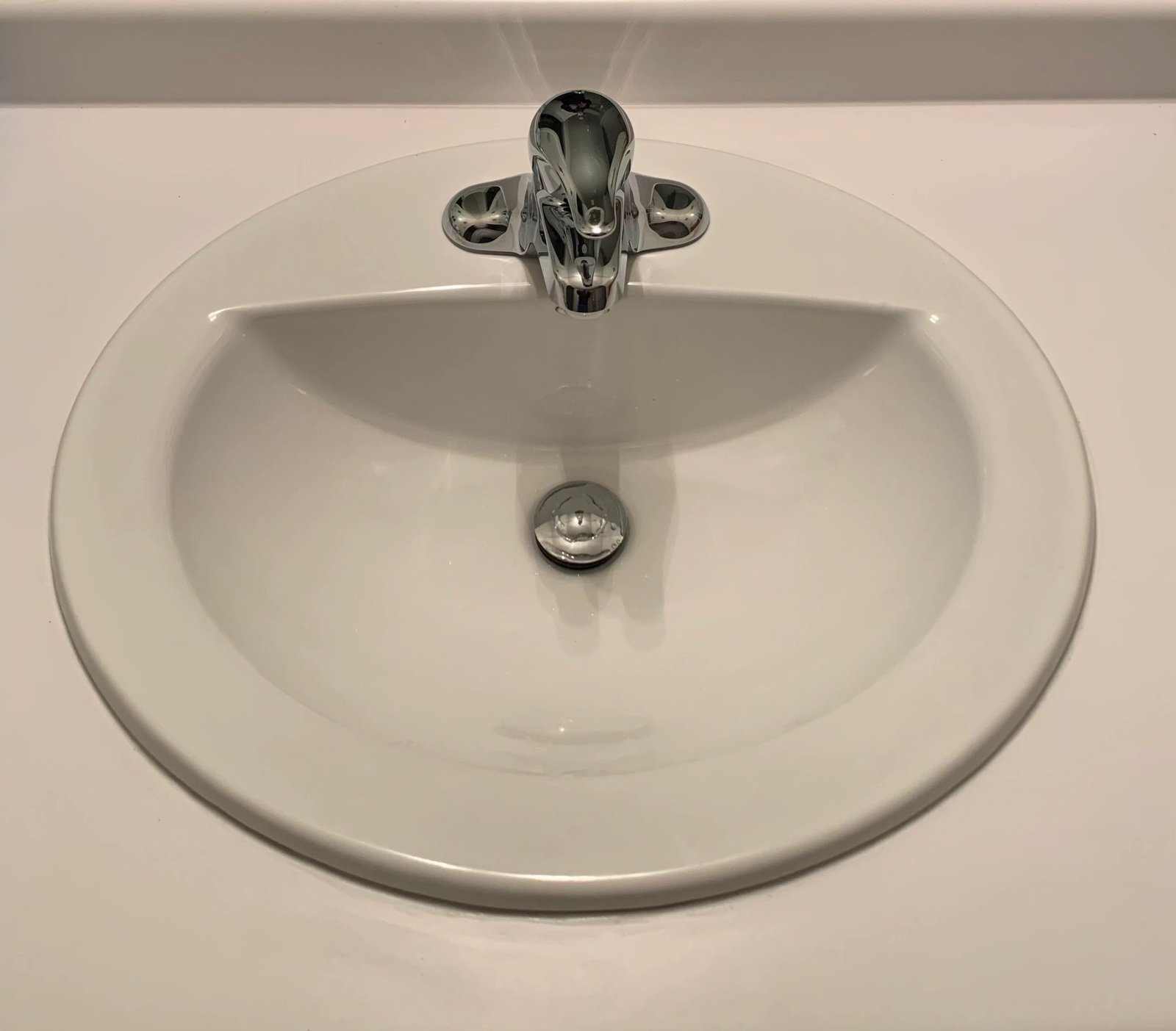 Drop-in sink basin with new faucet