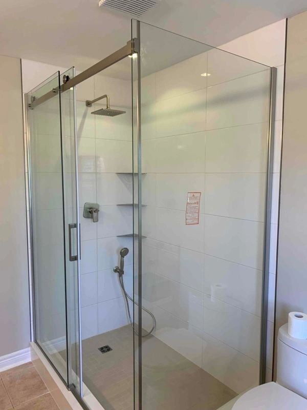 Glass shower enclosure