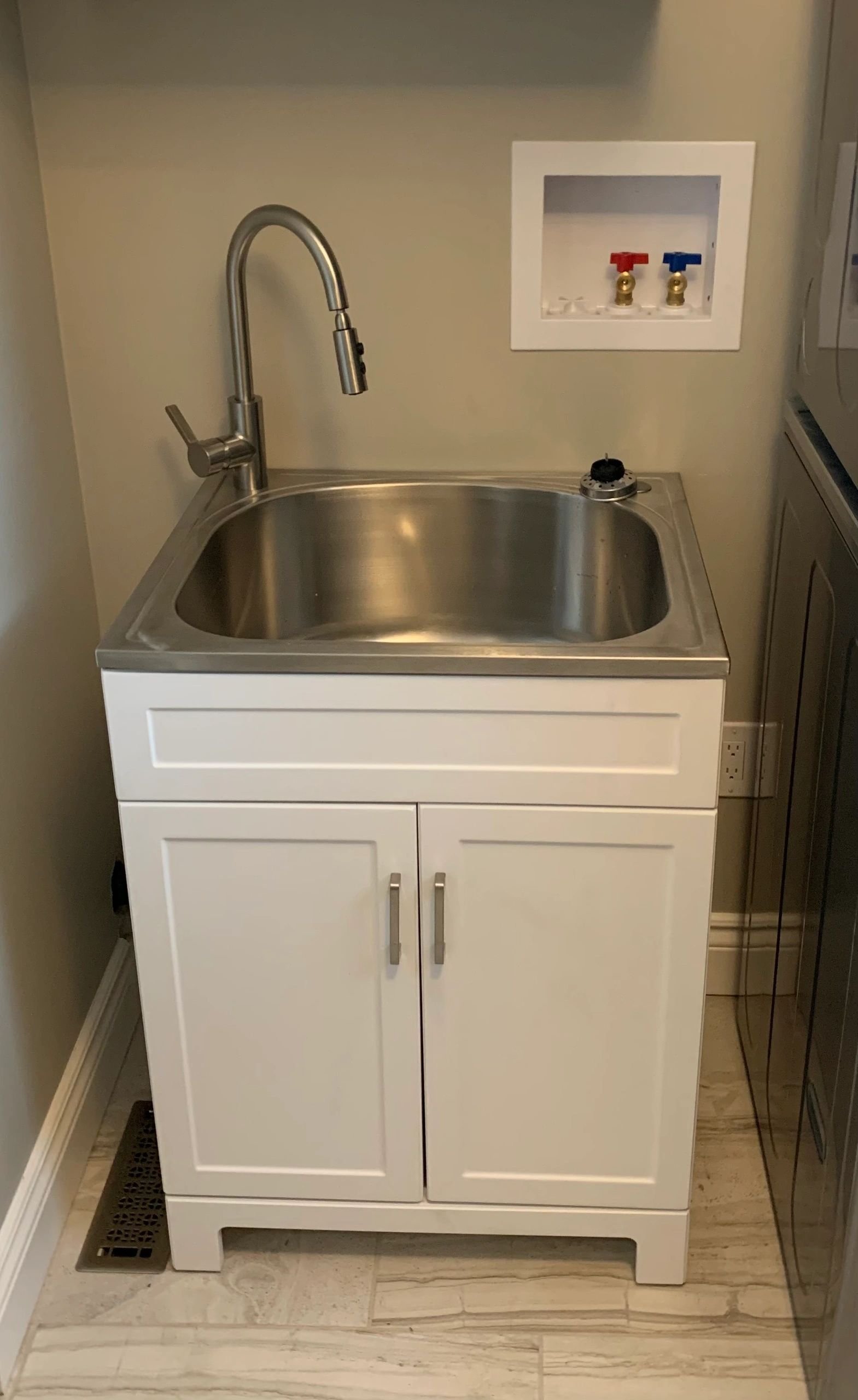 Utility bar sink in white cabinet